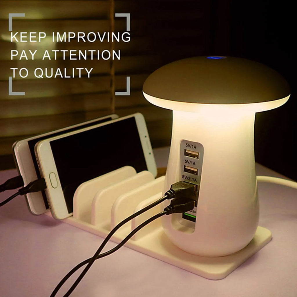 White mushroom-shaped USB charging dock station with five ports and a glowing LED light on a desk.