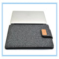 Frosted woven laptop bag with plush felt interior shown open to reveal corner protectors and organised storage