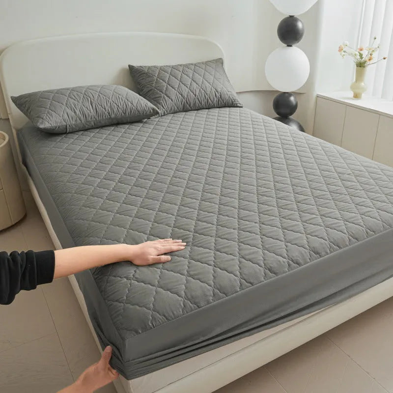 Diamond lattice quilted waterproof mattress protector set with bamboo fibre fitted sheet and pillowcases.