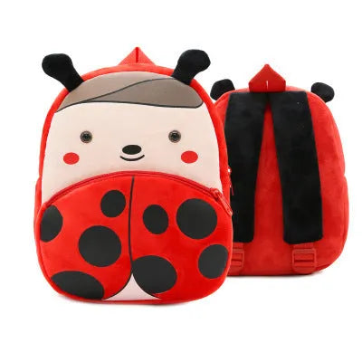 Soft plush children's backpack with cartoon animal design, showing zippered main compartment.