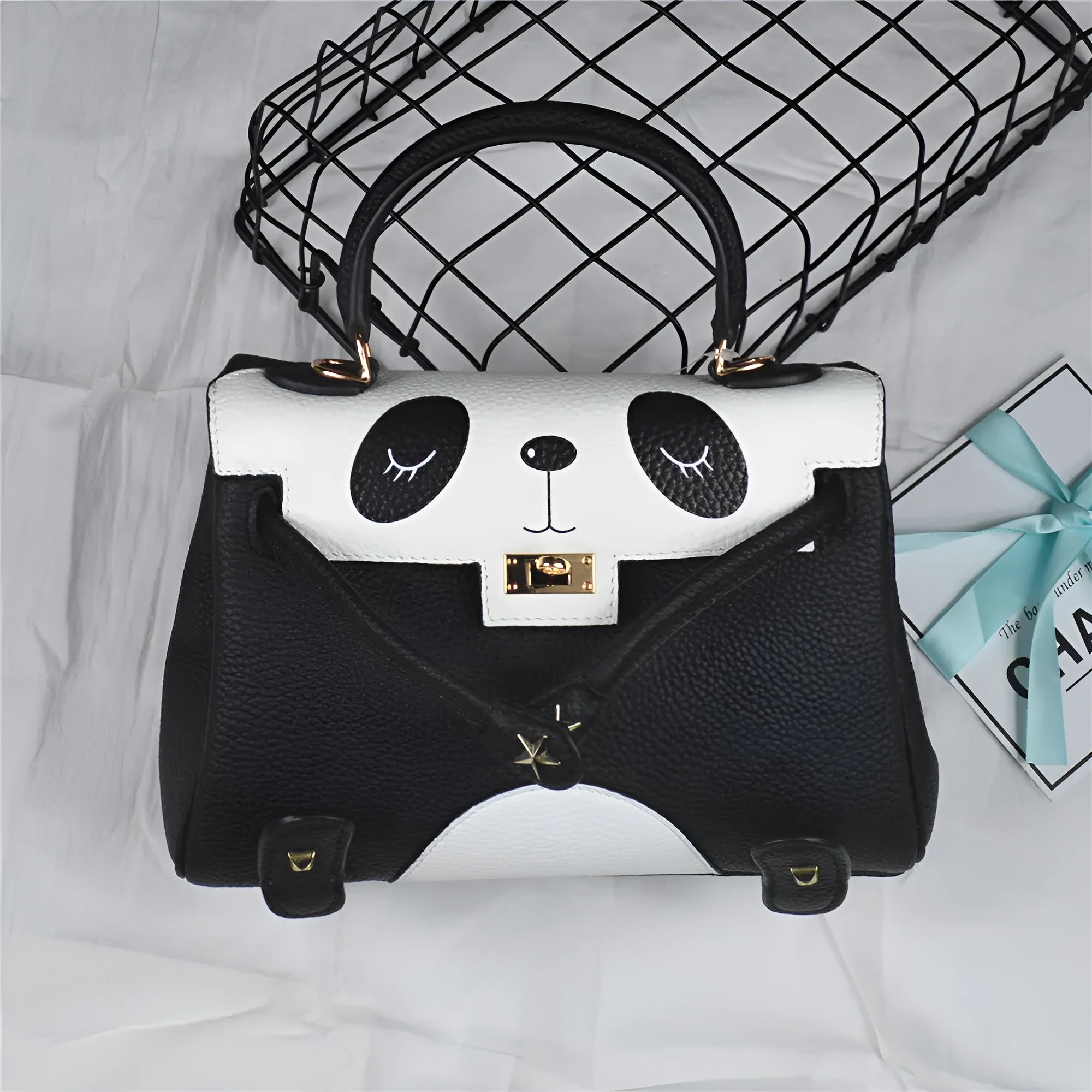 Cow leather panda handbag with animal print pattern in horizontal square design showing printing details