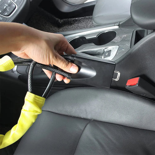 Red iron steering wheel lock with wire rope for a General Motors car.