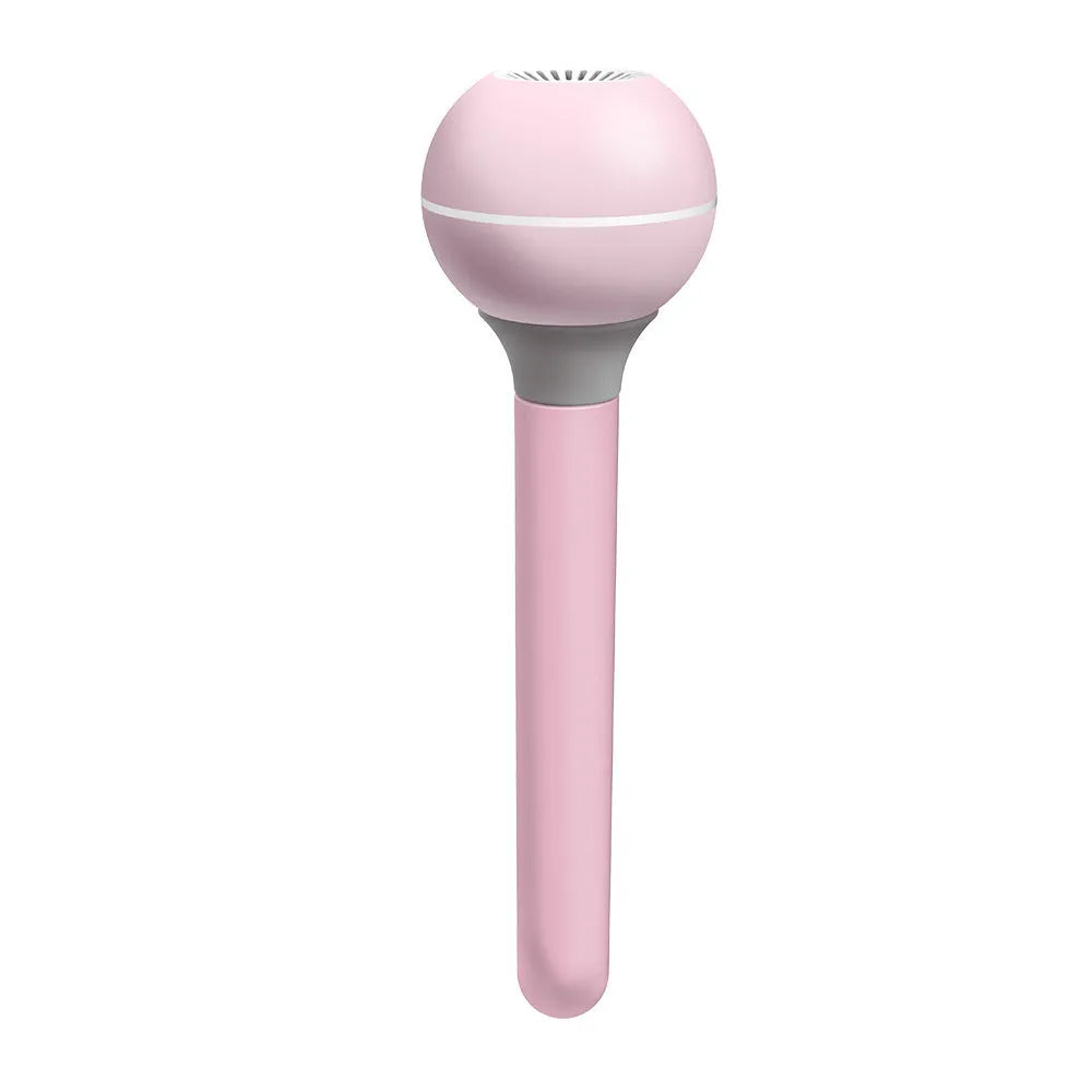 A columnar pink and white personal USB magic wand humidifier on a table.