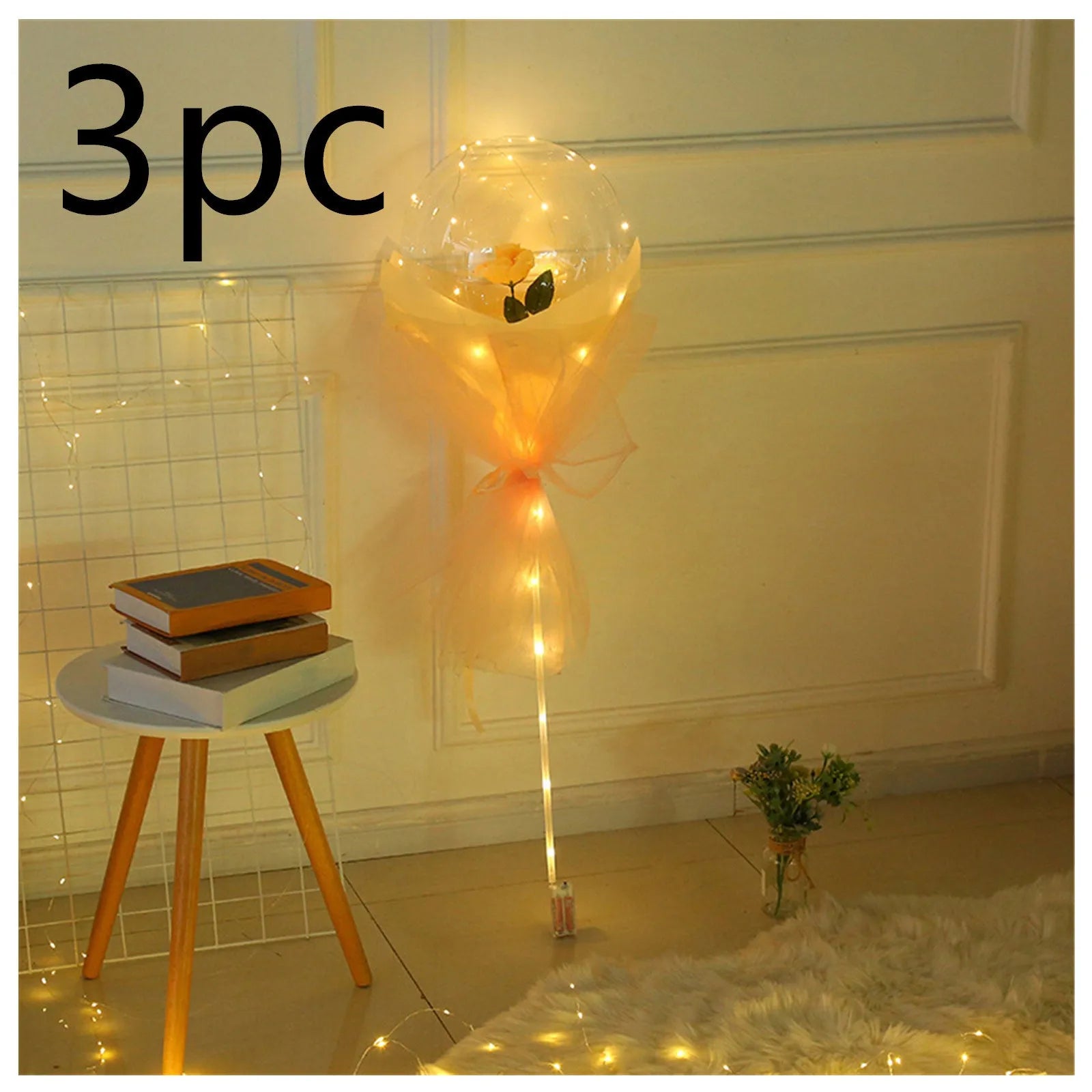 Transparent LED luminous balloon bouquet with artificial rose and glowing light inside, displayed as a DIY kit.