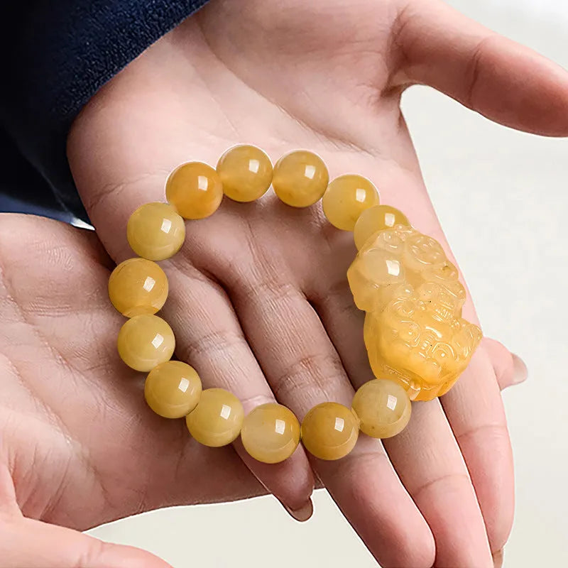 Carved Jinsi Jade money bracelet showing golden thread patterns in natural stone