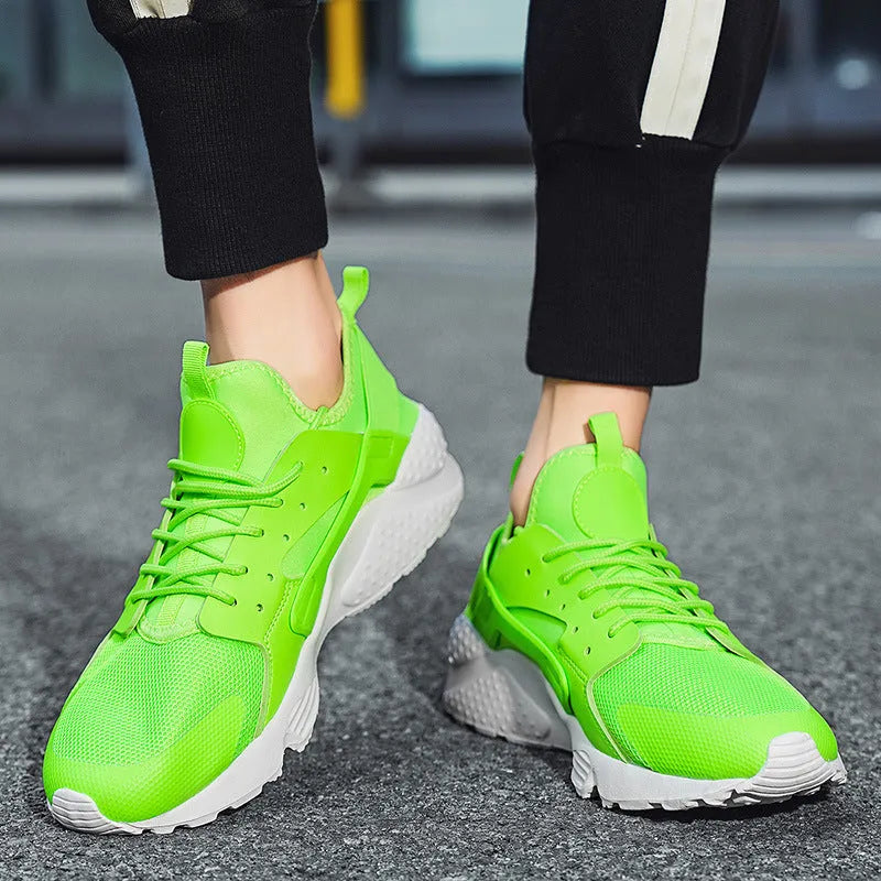 Men's low top casual shoes in green with mesh upper, flat heel, and lace-up front closure