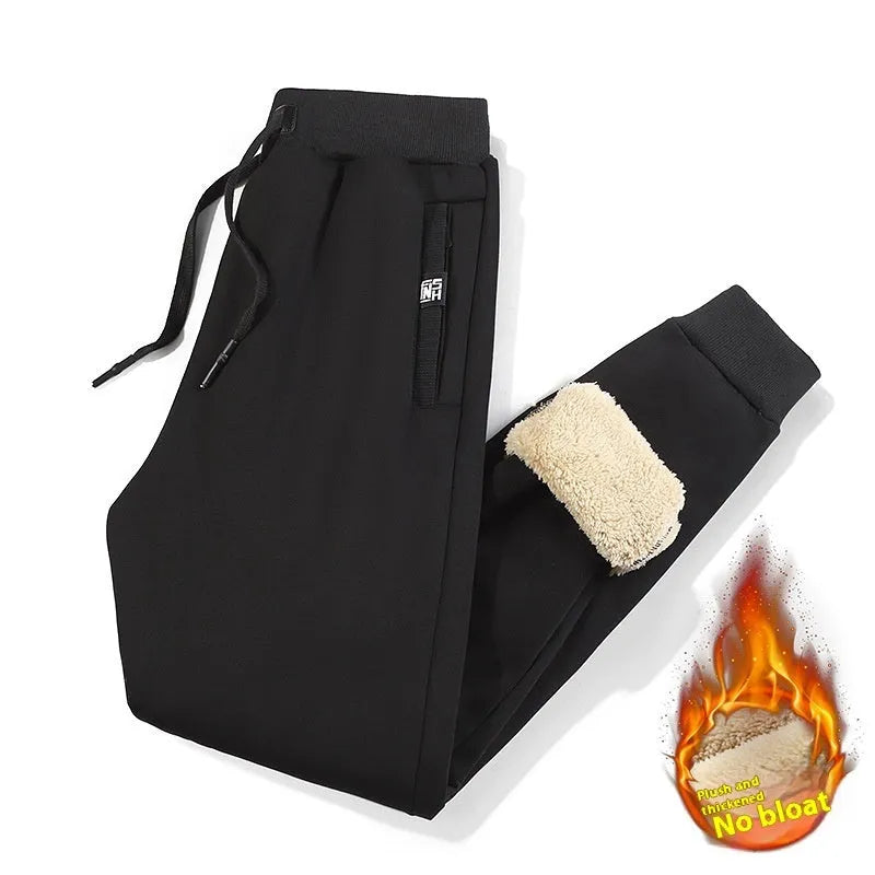 Men's grey fleece-lined oversized cotton track pants with an elastic mid-waist.