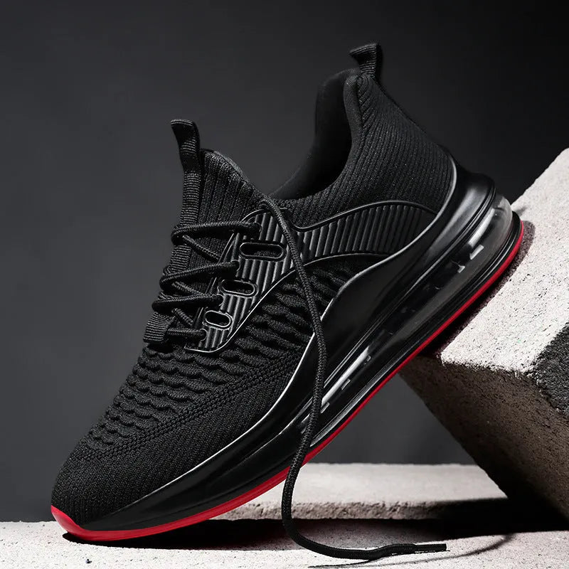 Men's low-top black mesh running sneakers with a round toe and lace-up front on a rubber sole.
