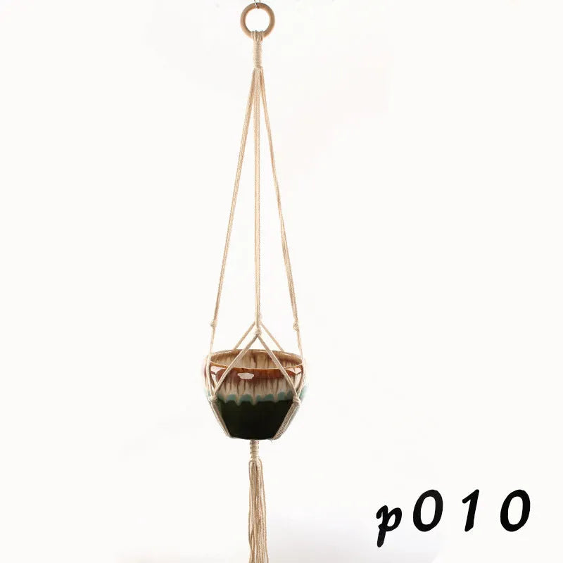 Woven cotton rope plant holder in a desktop style with greenery inside.