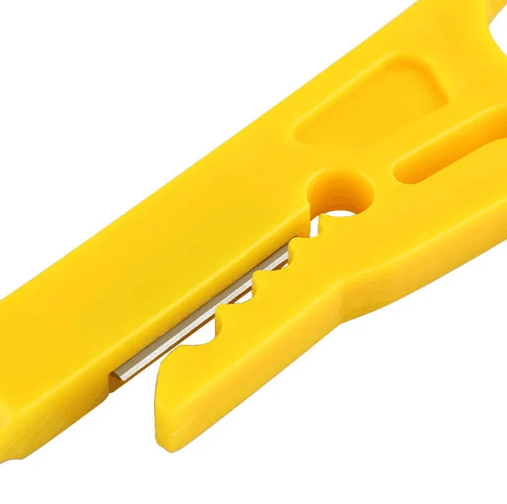 Yellow portable wire stripper tool with metal snap-in frame, showing 0.6 mm stripping diameter for network cables.