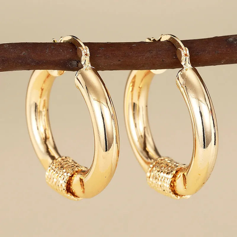 Geometric copper ear clips with ring design in golden colour for women