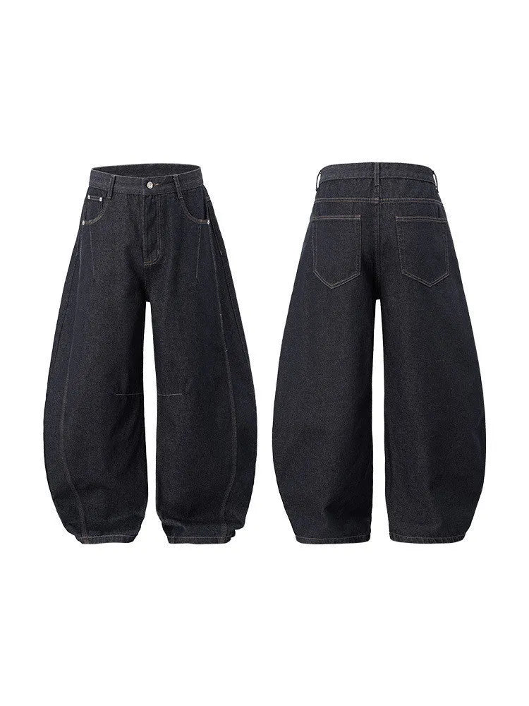 Men's original cow colour wide leg denim trousers with a mid-waist, laid flat.