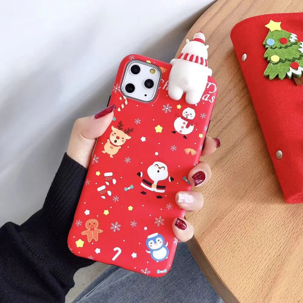 Red Christmas-themed silicone phone case on an iPhone, showing festive back cover design.