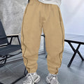 Man wearing blue bamboo fibre casual trousers with a cropped leg and loose fit.