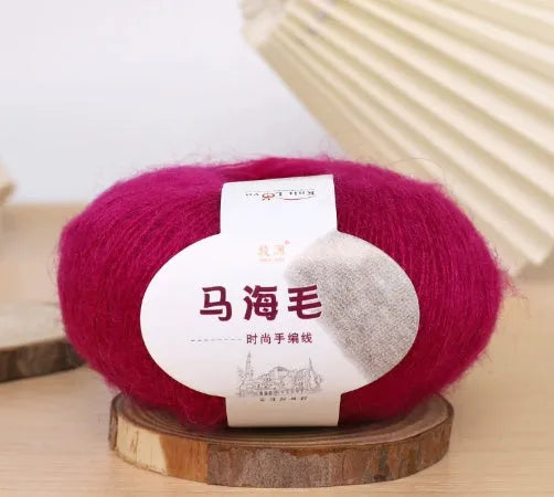 Single ball of mohair yarn in various colours for hand-woven DIY scarf knitting projects