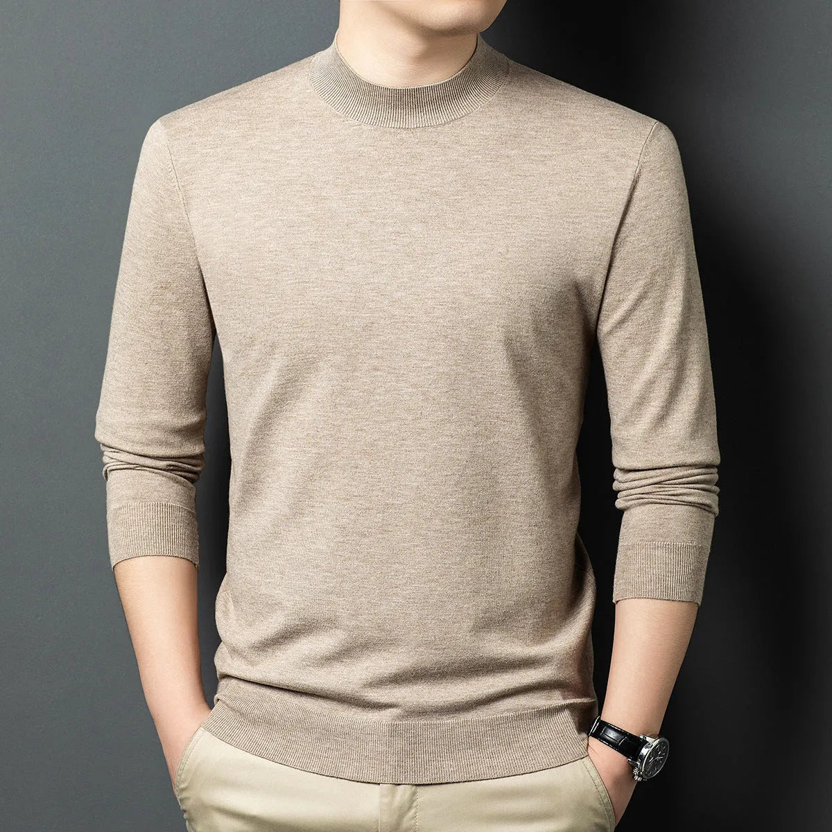 Men's round neck grey wool blend pullover sweater with long sleeves on a hanger.