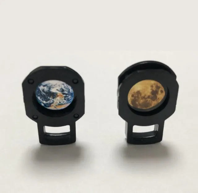 Earth and moon projection lamp with adjustable hose bracket on wooden surface