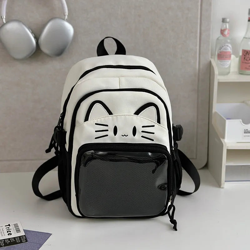 Korean cartoon large capacity nylon backpack in pink colour with badge pendant.