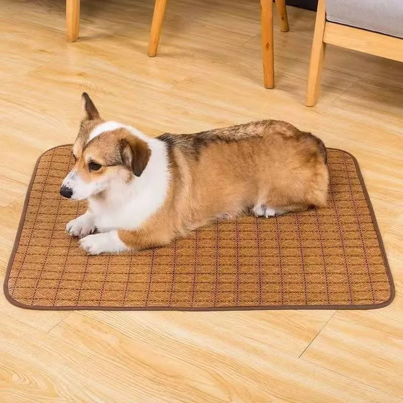 Brown woven rattan cooling mat for dogs on a wooden floor.