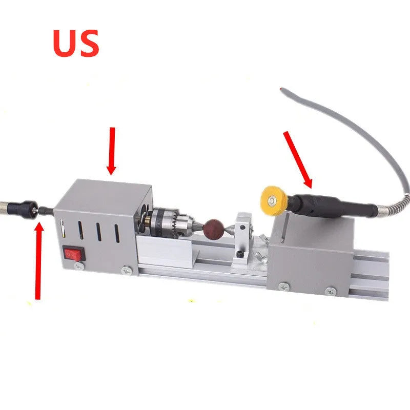 Silver metal mini woodworking lathe with carving knives on a workbench