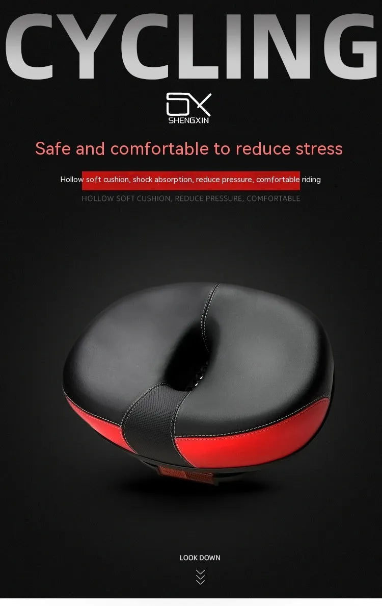 Large red bicycle saddle with reflective stickers, showing thickened design and shock absorber.