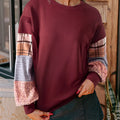 Women's beige and red plaid stitching long-sleeved loose fit casual pullover top.