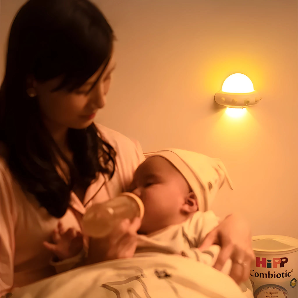 Remote control UFO shaped bedside night light in blue, pink, or white colour.