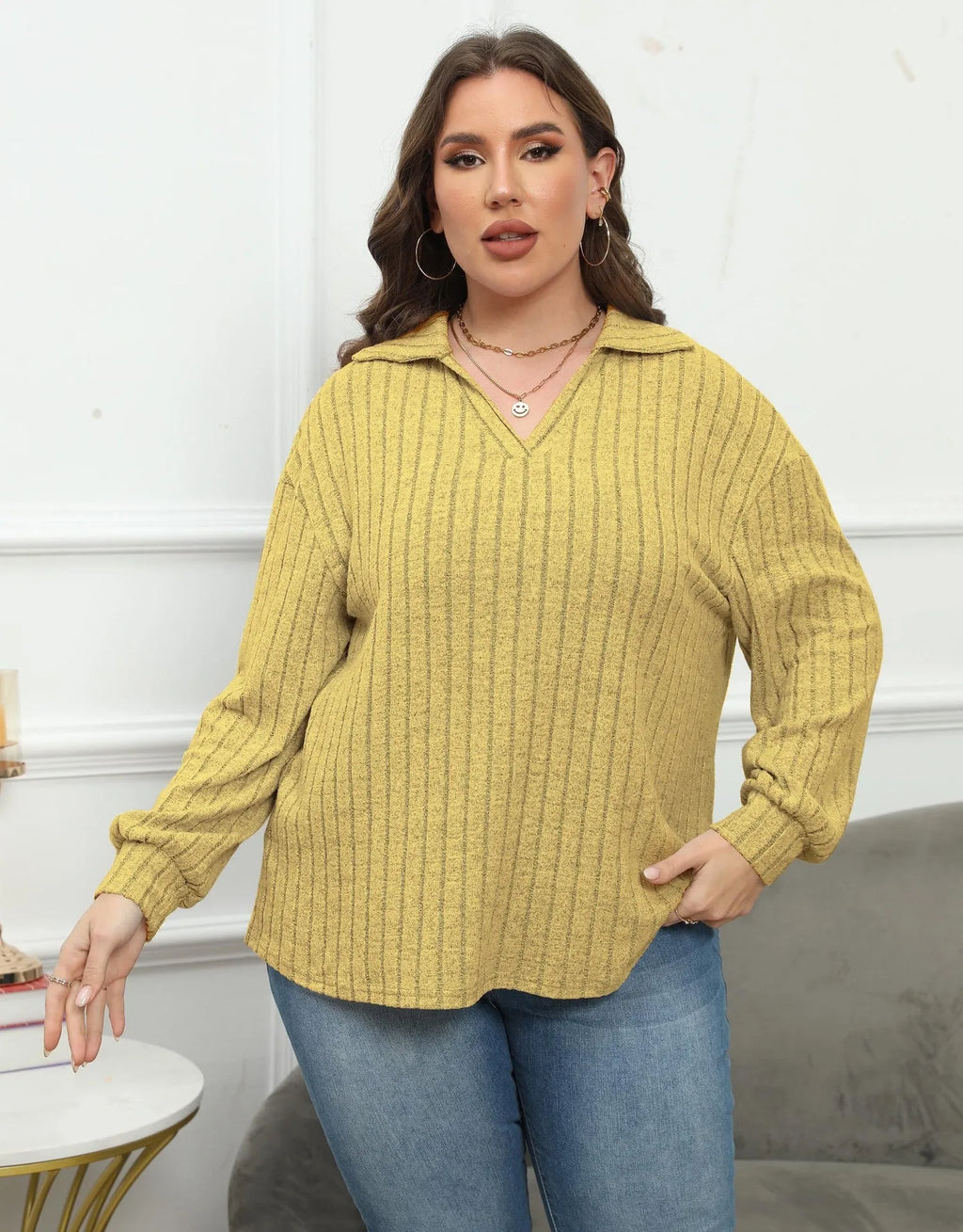 Women's plus size gray polo collar fleece shirt with lantern sleeves on a hanger