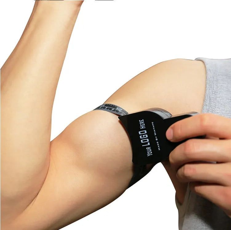 Black digital body fat calliper with sliding pointer and measurement gauge