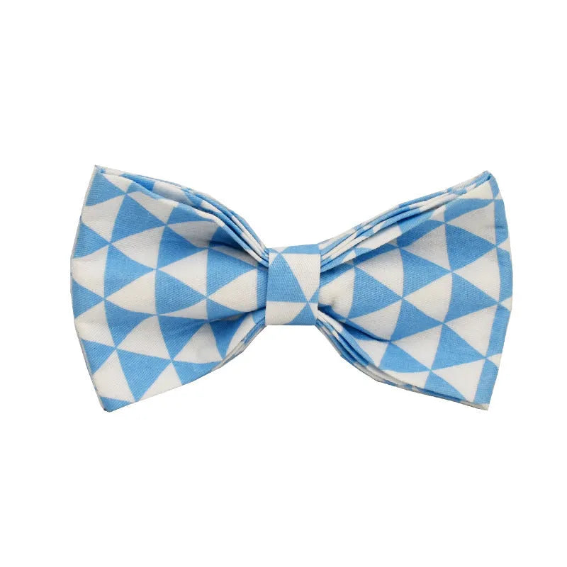 Blue triangular pattern dog harness set with matching leash, collar, and fabric bow accessory