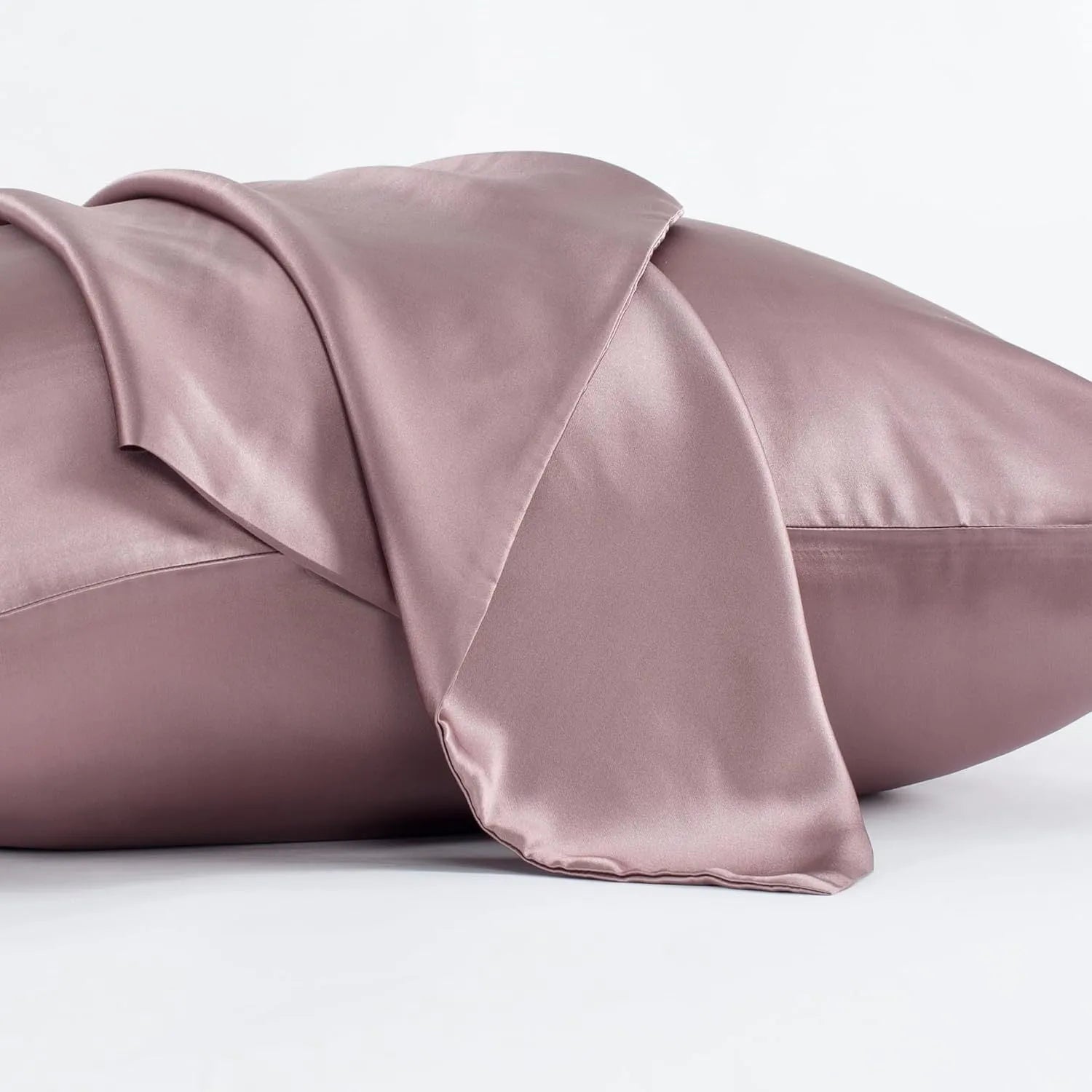 Dark grey silk pillowcase with envelope closure, shown flat and on a pillow.