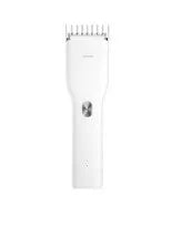 Black and white Boost model cordless hair clipper with adjustable comb on a stand
