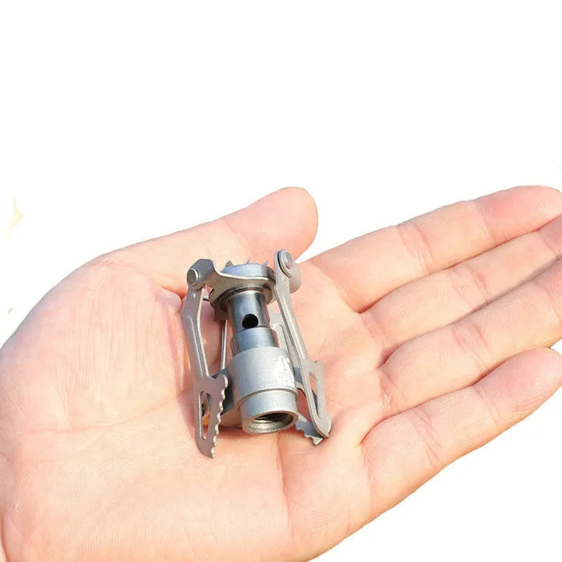 Portable gas camping stove with one-piece furnace structure for outdoor cooking