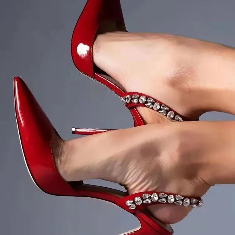 Women's black patent leather pointed toe high heel sandals with rhinestone details on the sides