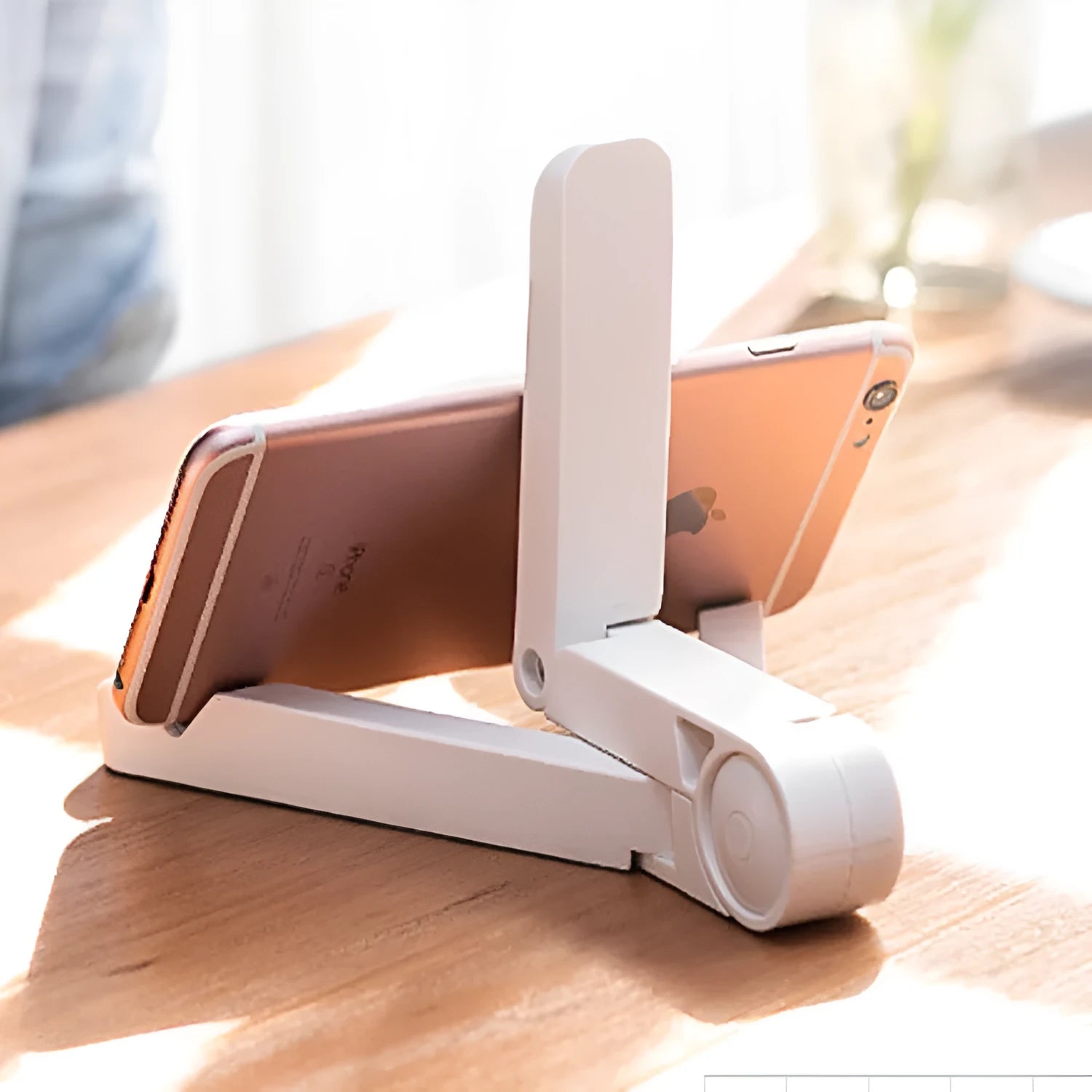 Black foldable tablet holder showing unfolded stand position with device placement area