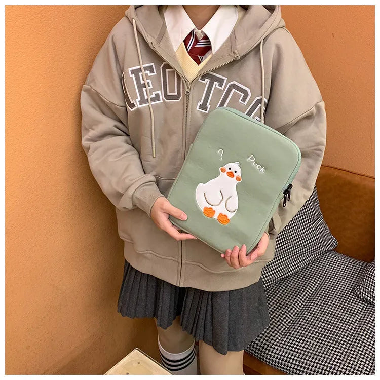 Blue tablet case with cartoon duck embroidery design and zipper closure