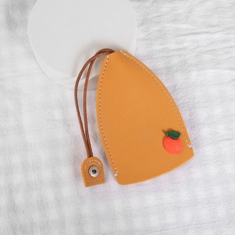 Cartoon pull-out car key case in PU leather with colourful designs measuring 14 x 7.5 cm