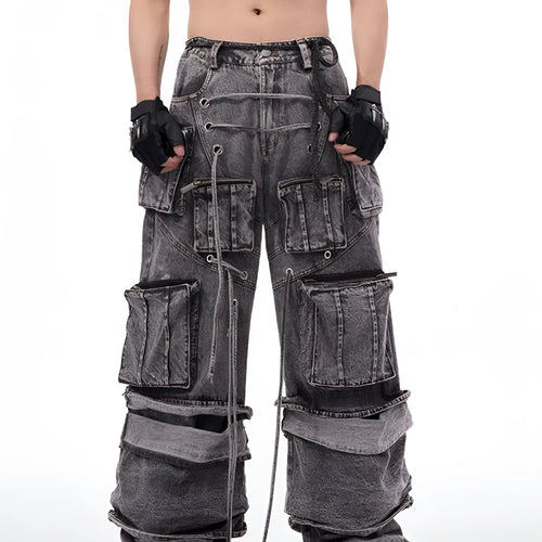 Grey distressed denim overalls with rope stitching detail on a hanger.