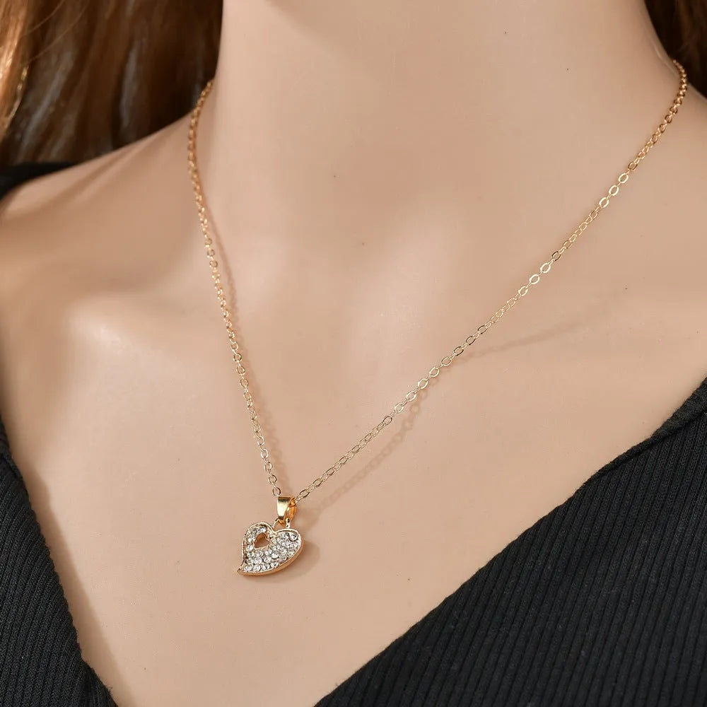 Women's gold electroplated alloy jewellery set with adjustable necklace, earrings, and bracelet