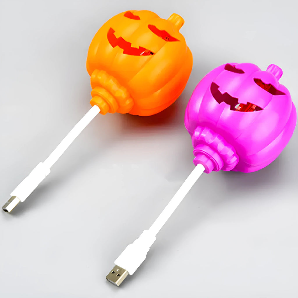 Plastic pumpkin-shaped USB lamp emitting purple or yellow light, 8.3cm wide.
