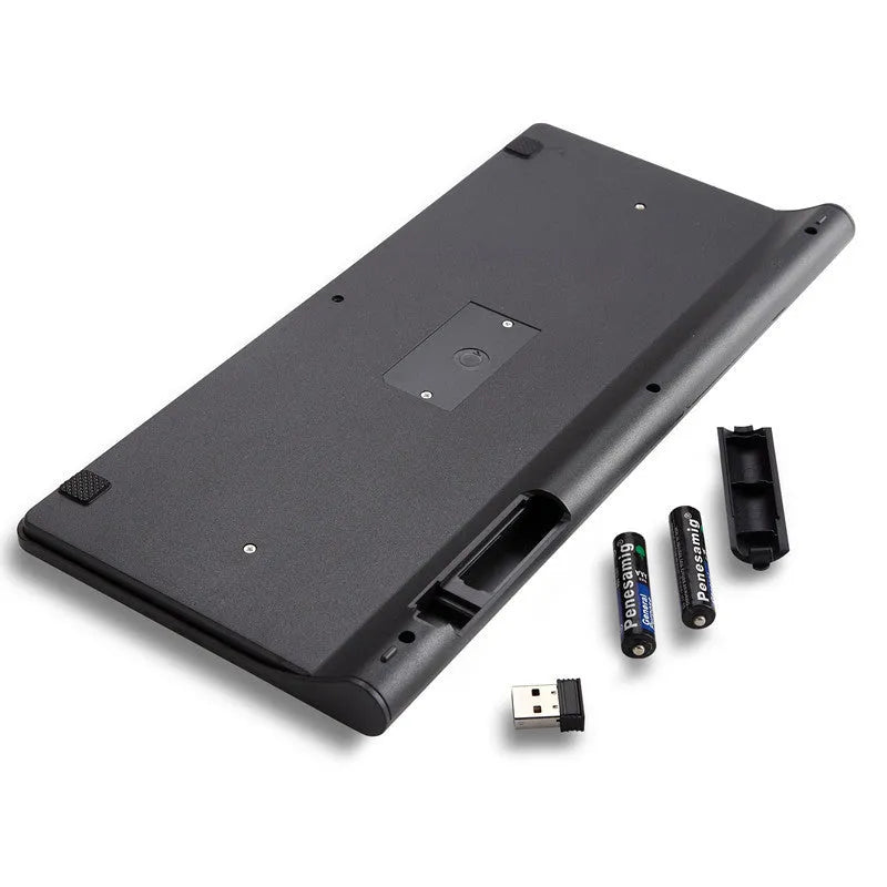 Black wireless keyboard and mouse set with 4G receiver on wooden desk