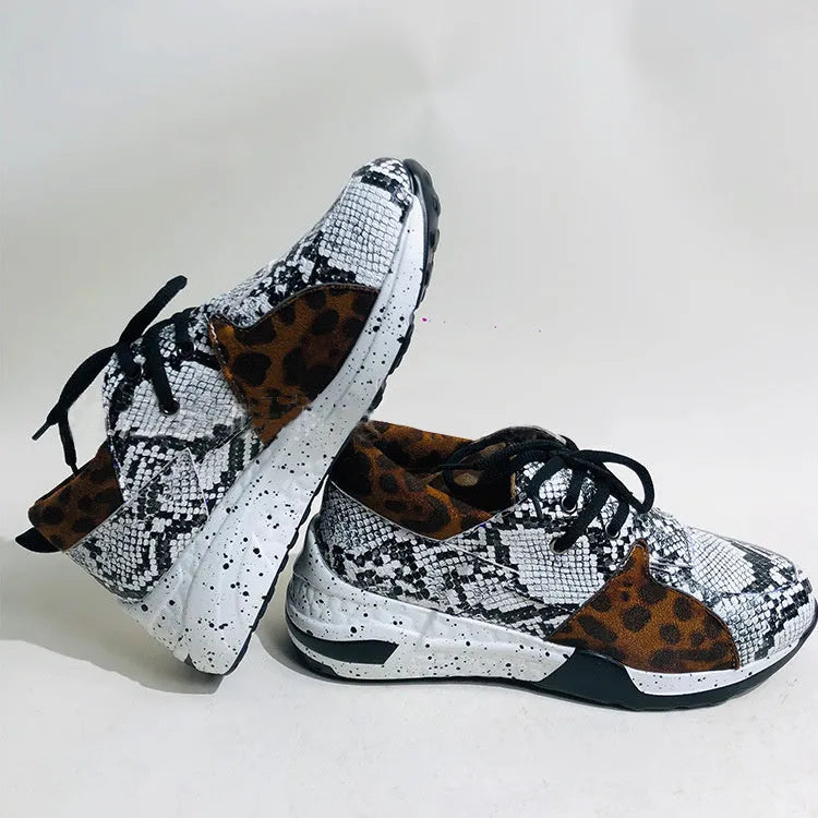 Women's casual suede sneakers with a wedge heel in various colours including black, pink, and leopard print.