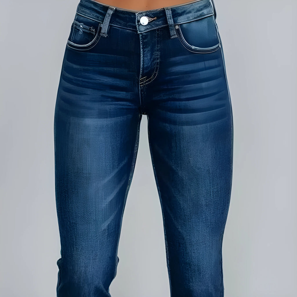 Women's dark blue cotton denim jeans with hand-distressed detailing and casual styling