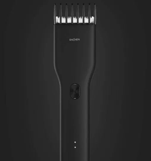 Black and white Boost model cordless hair clipper with adjustable comb on a stand
