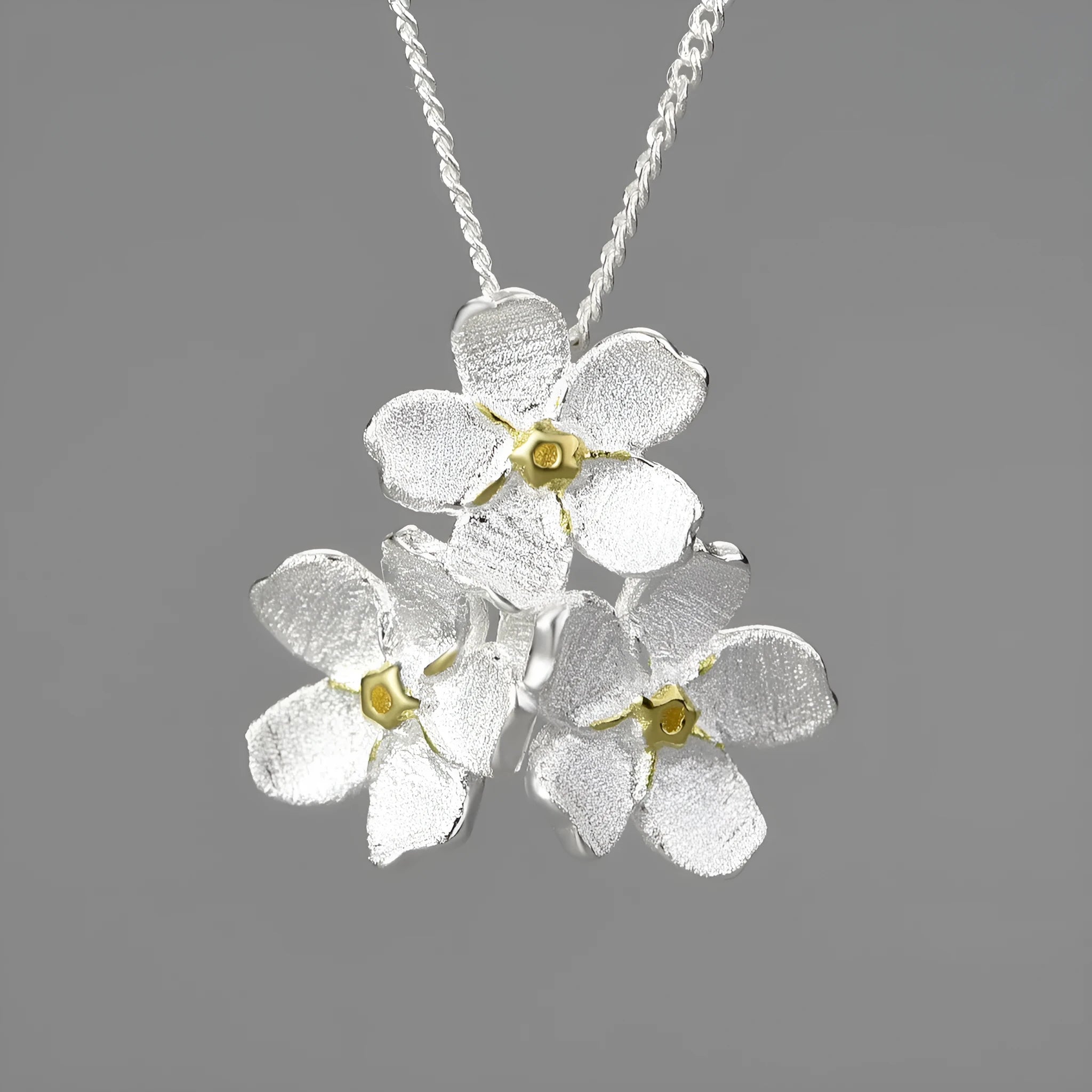 Myosotis Sylvatica forget-me-not flower sterling silver pendant with open mouth pastoral design