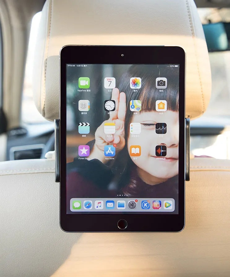 Black car headrest-mounted phone and tablet holder with universal snap-in silicone cradle.
