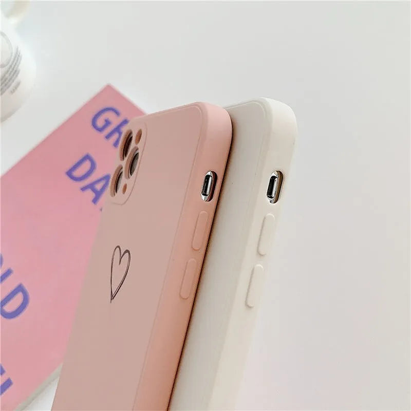 Silicone TPU back cover case for iPhone in solid colours like black, pink, and green on a white background.