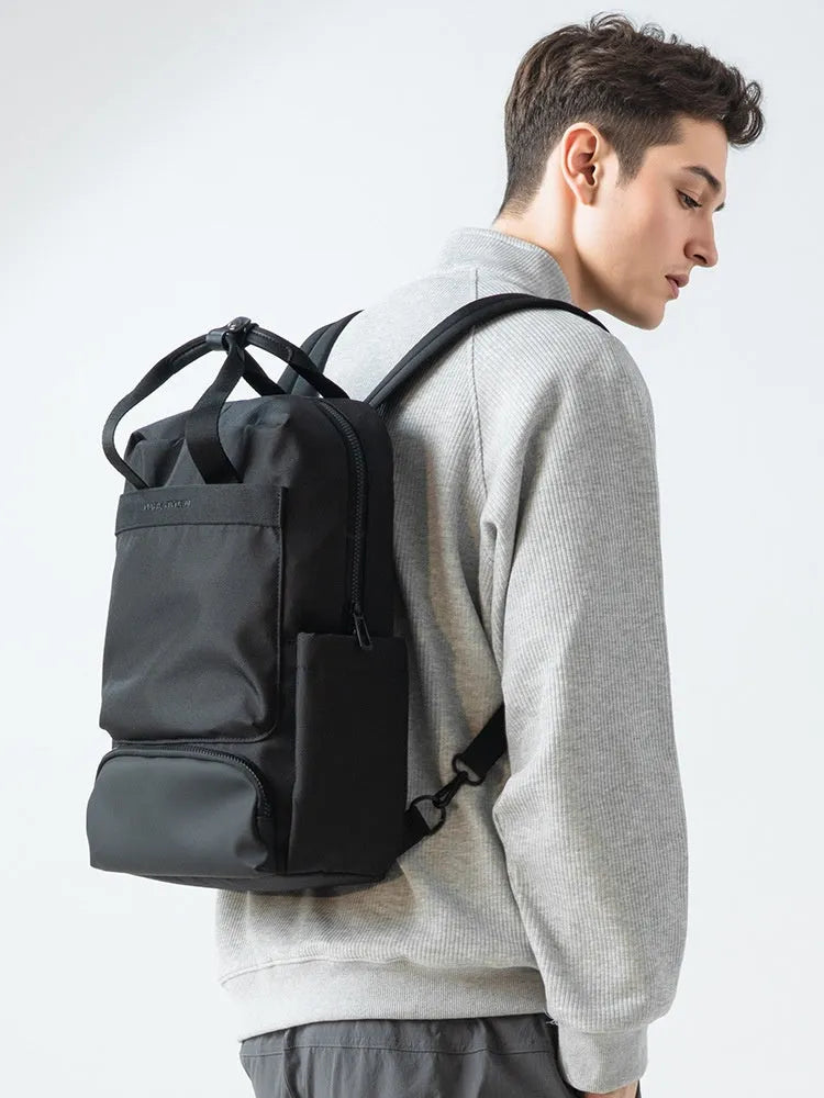 Front view of lightweight black Oxford cloth computer backpack with 20-35L capacity