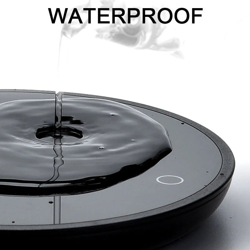 Black circular USB cup warmer pad with a tempered glass surface and dual temperature switch
