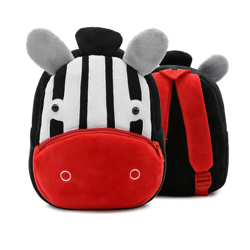 Soft plush children's backpack with cartoon animal design, showing zippered main compartment.